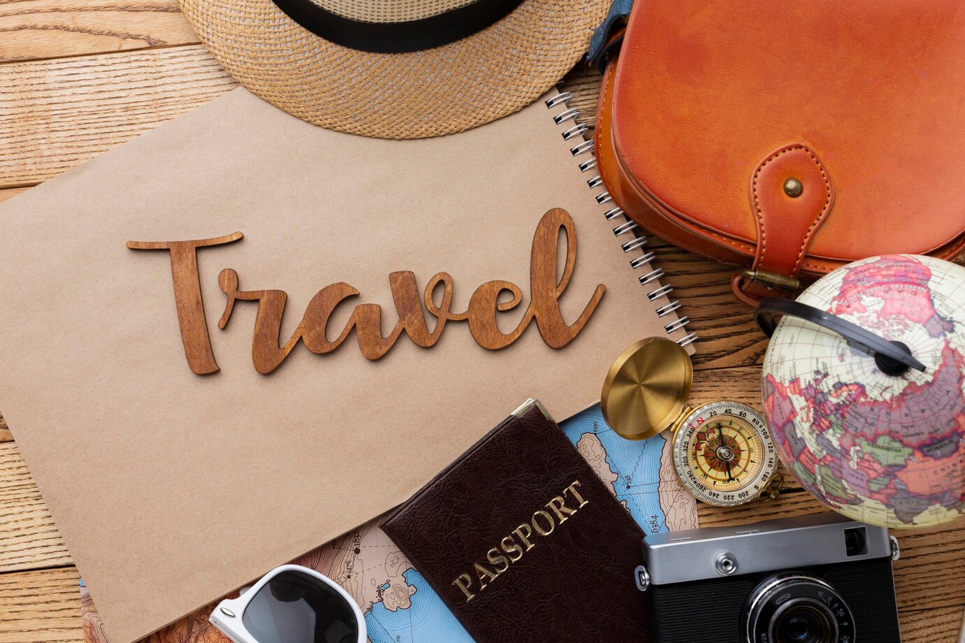 travel items on wooden background top view 23 2148971054